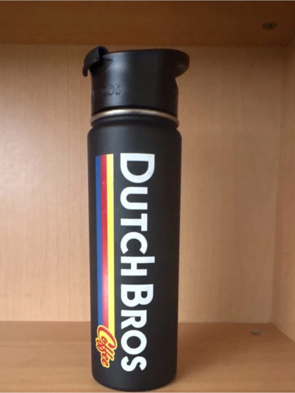Dutch Bros Black Bottle with Vertical Rainbow Stripe
